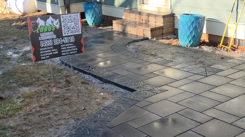 Paver patio and steps built up to a back door in Cleveland, Tennessee