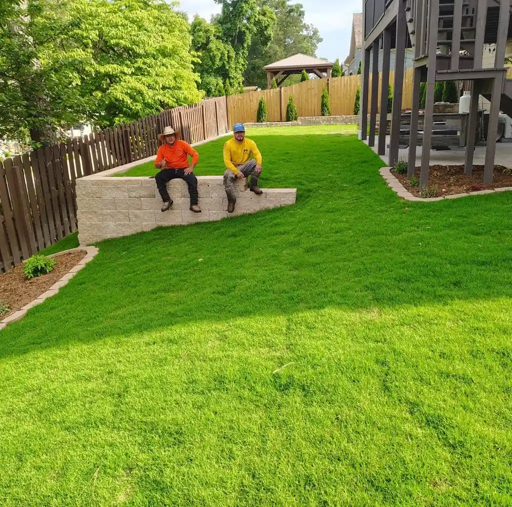 New lawn and block seat wall in a fenced back yard in Cleveland, Tennessee